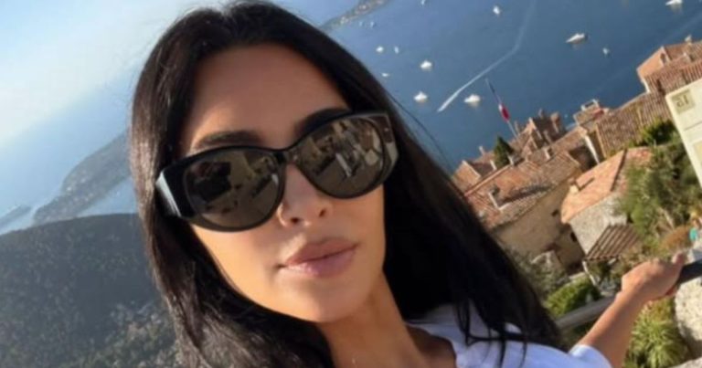 Kim Kardashian Strikes a Sultry Pose in a Dress That Barely Covers Her Curves
